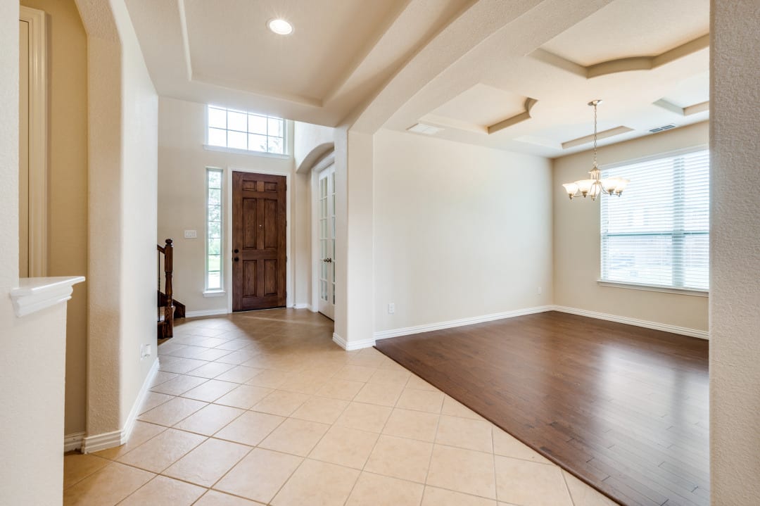 Wide-plank flooring in the entry and open living space