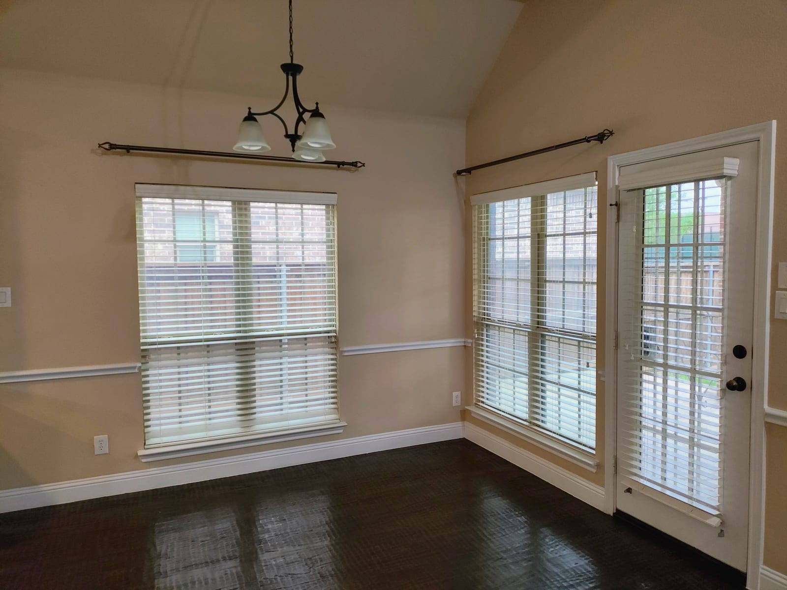 Clean, move-in-ready living room with polished wood floors