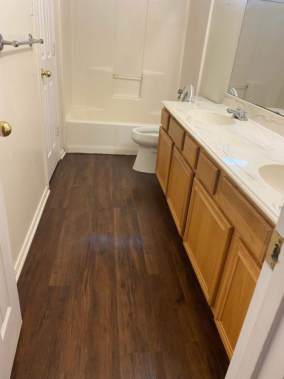 Guest bathroom renovation with new flooring and vanity